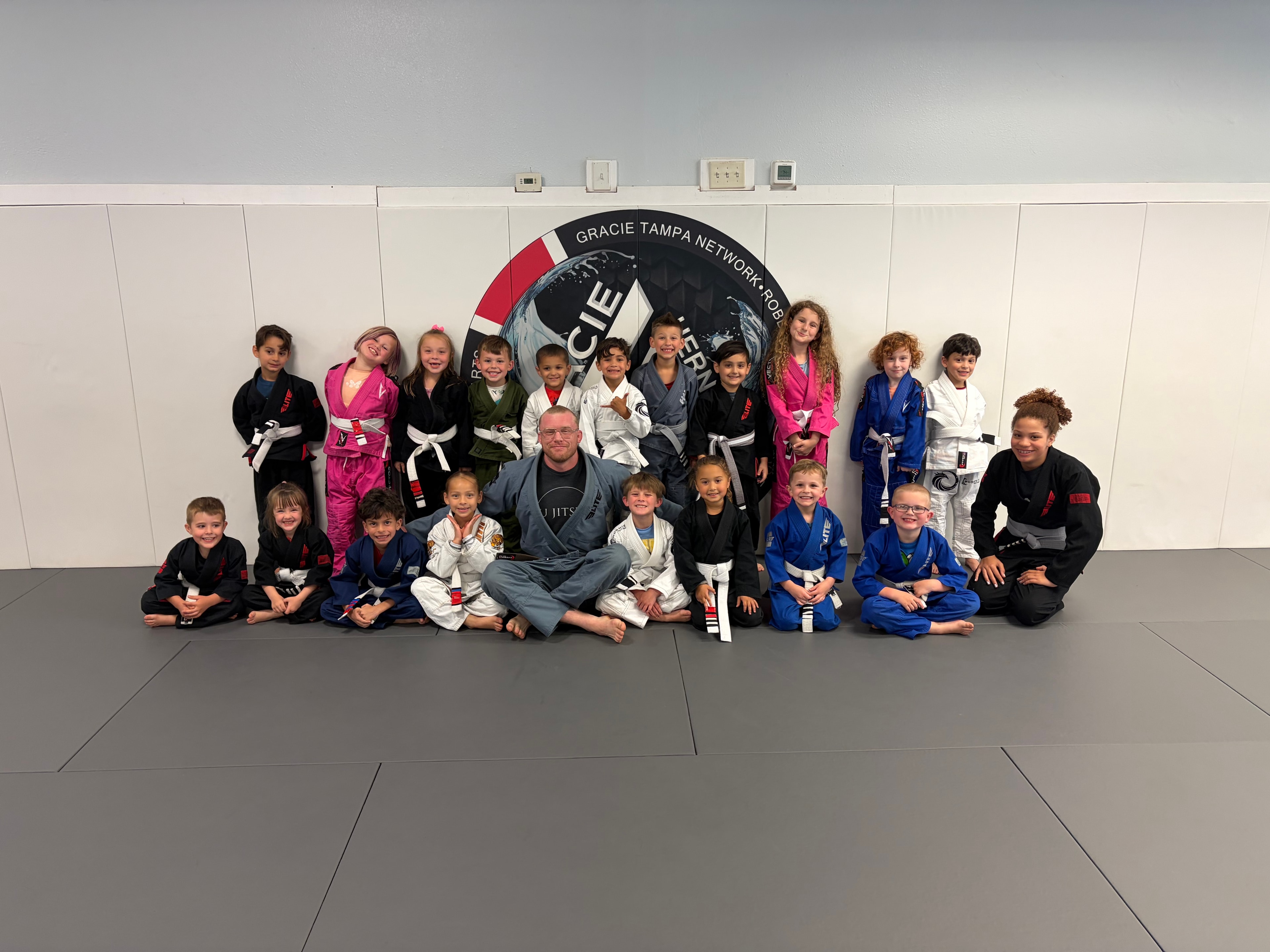 Young children training jiujitsu